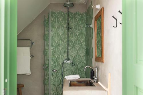 a bathroom with a sink and a shower at Siggesta Gård in Värmdö