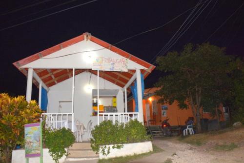 a gazebo with a sign on it at night at Posada Miss Portia in Providencia