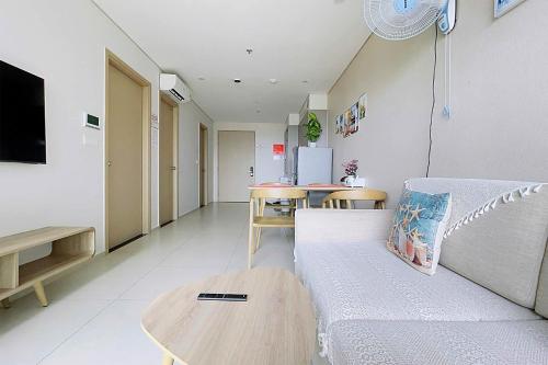 a living room with a couch and a table at The Sóng Luxury Apartment Vung Tau - Tuấn Hoà Homestay in Vung Tau