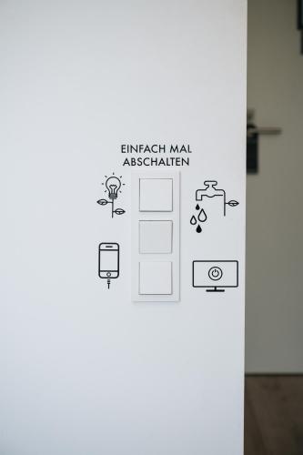 a door with a sign that reads embassy mars activation at Coffee Fellows Hotel & Longstay in Pfaffenhofen an der Ilm