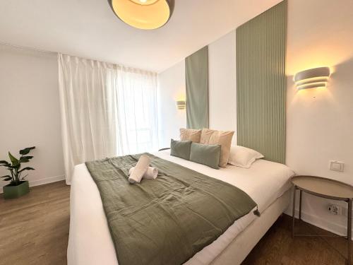 En eller flere senge i et værelse på Le Duplex Mitterrand, Centre de Saint Jacques