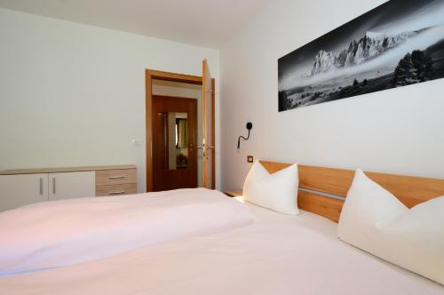 Postel nebo postele na pokoji v ubytování Residence Albierch