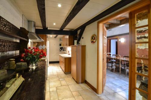 a kitchen with a counter and a dining room at Gîte Oncle Yerry Ostheim in Ostheim