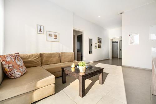a living room with a couch and a table at Keshet Eilon Galilee Views Retreat by Sea N' Rent in Elon