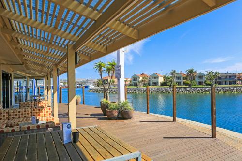 a wooden deck with a view of the water at Marina Hotel in Port Lincoln