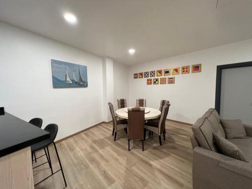 a living room with a table and a couch at Ramada by Wyndham Langkawi Marina in Kuah