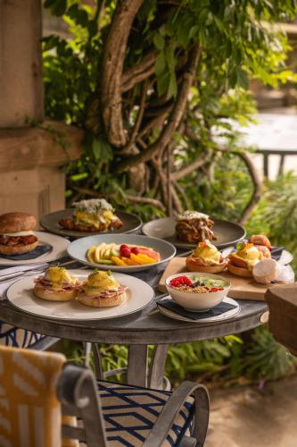 a table with plates of food on it at Langdale Chase Hotel in Windermere