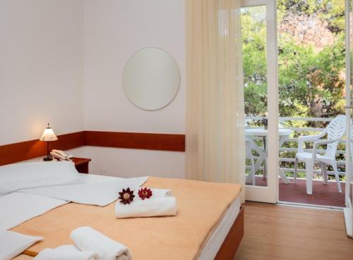 Postel nebo postele na pokoji v ubytování Fontana Resort
