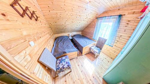 an overhead view of a room in a tiny house at Cozy Wooden House with Fireplace near Zabljak & Durmitor in Žabljak