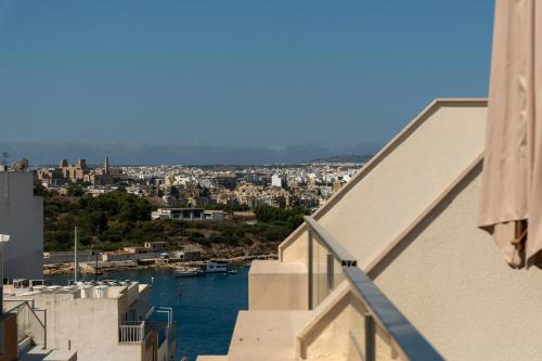 a view of a city from a balcony at The Penthouse by Shmoo - Sliema Ferries in Sliema