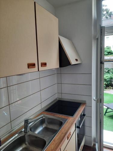 a kitchen with a sink and a counter top at Apartment in Bayreuth in Niederdorla