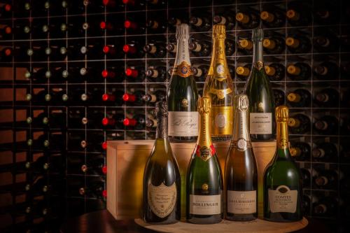 a group of wine bottles sitting on a shelf at Langdale Chase Hotel in Windermere