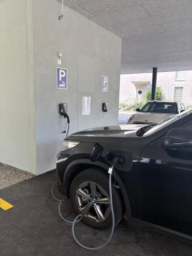 a car is being charged at a gas station at LabPark enjoy Melano in Melano