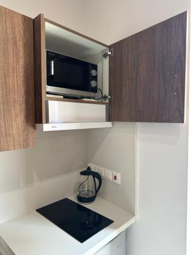 Η κουζίνα ή μικρή κουζίνα στο Kallistheni - Stylish Studio Apartments in Lefkara