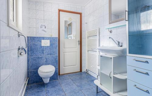 a bathroom with a toilet and a sink at 2 Bedroom Beautiful Home In Erm in Erm