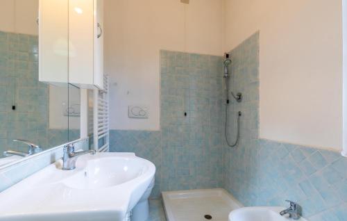 a bathroom with a sink and a mirror and a tub at Awesome Home In Capolona in Capolona