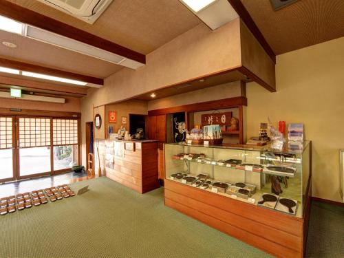a large room with a display case in a store at Kaihinsou Kamakura in Kamakura