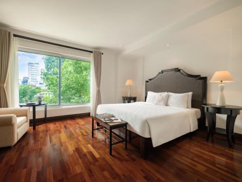 Katil atau katil-katil dalam bilik di Elegant Suites Central