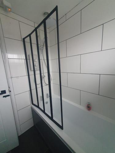 a bathroom with a mirror on the wall at Double Room in Shared House in Lavant