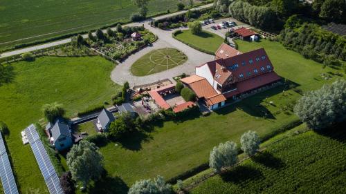 an aerial view of a large house with a park at Domek z jacuzzi na Folwarku Żuławskim in Elblag