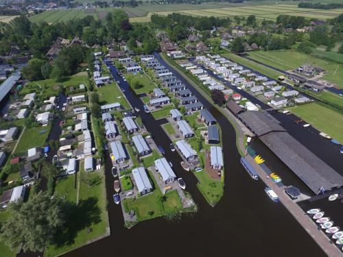 an aerial view of a parking lot next to a river at Chalet park Kroondomein Giethoorn in Giethoorn