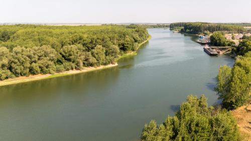 an aerial view of a river with trees at Tiena Hotel Plutitor in Turcoaia