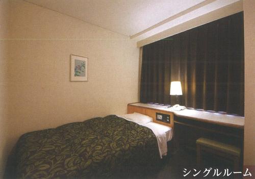 En eller flere senge i et værelse på Nakatsu Sunrise Hotel - Vacation STAY 64653v