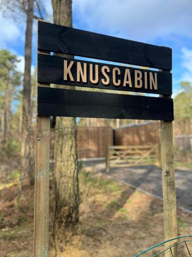 a wooden sign with the name at Knuscabin in Lille