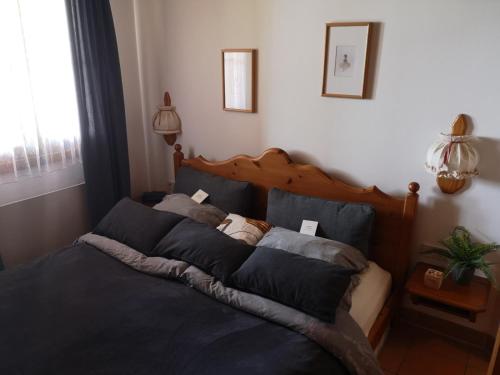 Ένα ή περισσότερα κρεβάτια σε δωμάτιο στο Cozy Alpe