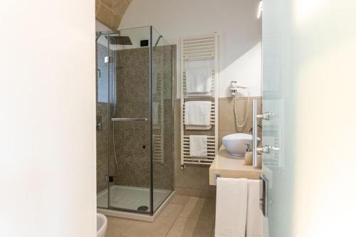a bathroom with a shower and a sink at Masseria Muntibianchi AgriResort Restaurant & SPA in Otranto