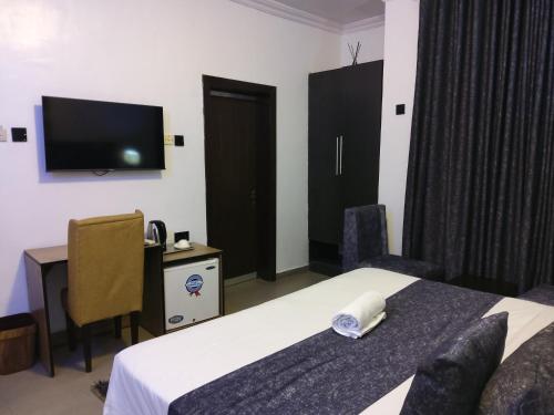 Ένα ή περισσότερα κρεβάτια σε δωμάτιο στο Crownedge Hotels