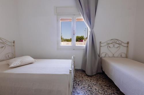 Ένα ή περισσότερα κρεβάτια σε δωμάτιο στο Villa Agua