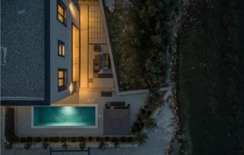 an aerial view of a house with a swimming pool at Villa Royal House 1 in Pašman