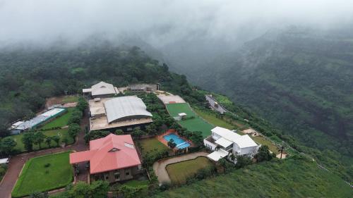 an aerial view of a house on a mountain at Ikshana Resort and Spa, Khandala in Lonavala
