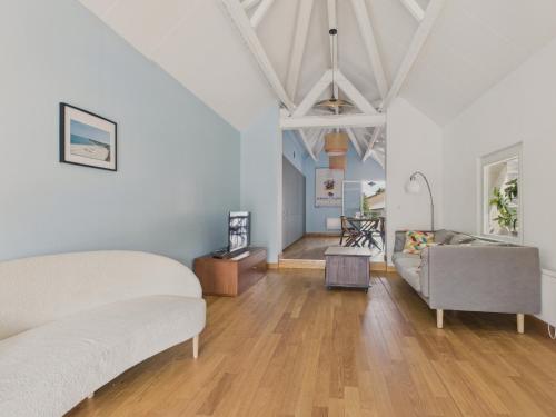 a living room with two beds and a couch at Maison avec terrasse et jardin à la Baule pour 6 in La Baule