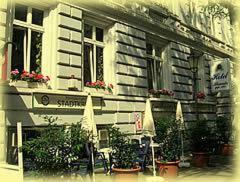 a building with chairs and plants in front of it at Alameda in Hamburg