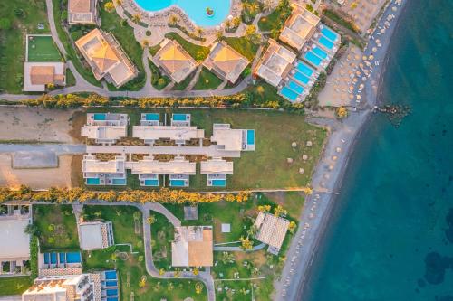 an aerial view of a resort complex next to the water at THEODOROU villas in Kos Town