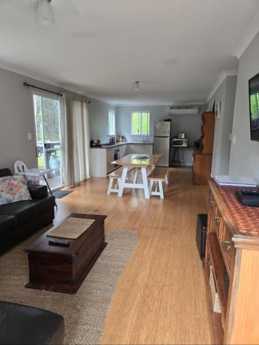 a living room with a couch and a table at 75 Peace Street in Denmark
