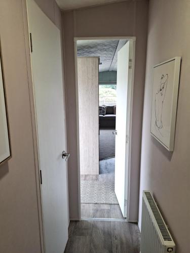 a hallway with a door leading to a bedroom at Hillside retreat - 2 bedrooms sleeps 5 in Westfield