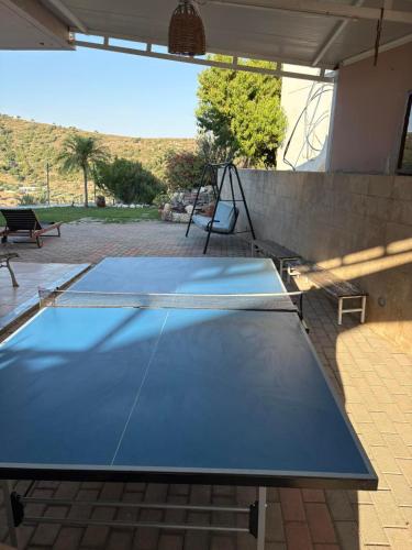 two ping pong tables sitting on a patio at Casa Maria Tsampika in Psinthos