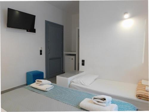 Ένα ή περισσότερα κρεβάτια σε δωμάτιο στο Aegean Studios Perissa