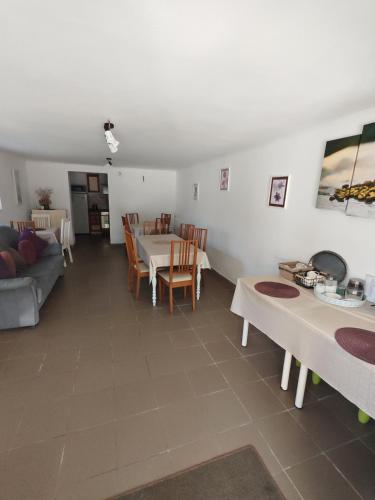 a living room with a table and a couch at Pension Klarissa in Sovata