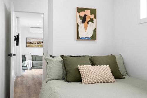 a living room with a couch and a painting on the wall at Hollow Mountain Cabin Laharum Dadswell Bridge in Laharum