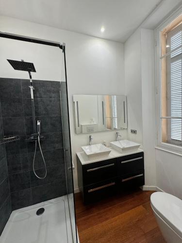 a white bathroom with two sinks and a shower at AC-Free Parking - Contemporary 4 Bedroom Villa Apartment in Cannes