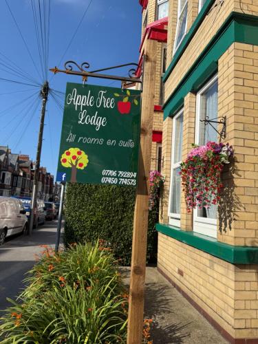 a sign for an apple tree bakery on a street at Apple Tree Lodge in Bridlington