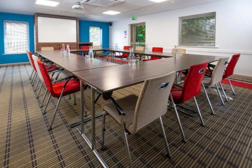 a conference room with a long table and chairs at Holiday Inn Express Taunton East by IHG in Taunton