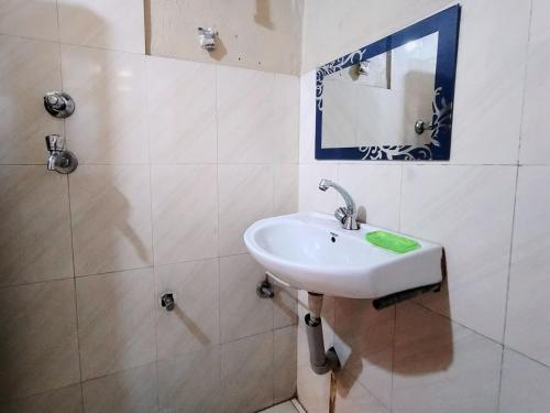 a bathroom with a sink and a mirror at Hostel Swastik in Bhaktapur