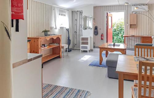 a living room with a kitchen and a dining room at Beautiful Apartment In Holmsjö With Wifi in Holmsjö