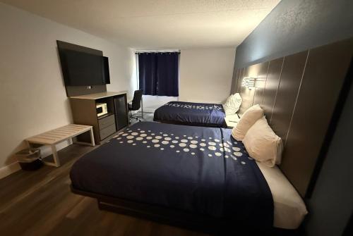 Postel nebo postele na pokoji v ubytování Coratel Inn and Suites By Jasper Lacrosse
