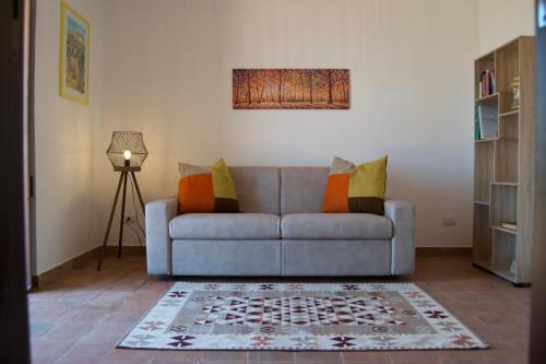 a living room with a couch and a rug at Villa Belvedere in Militello in Val di Catania